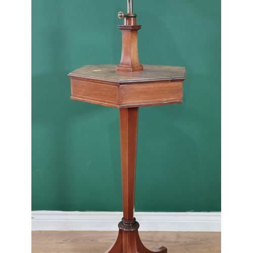 547 - An Edwardian mahogany Shaving Stand with shield-shaped bevelled mirror mounted on hexagonal two comp... 