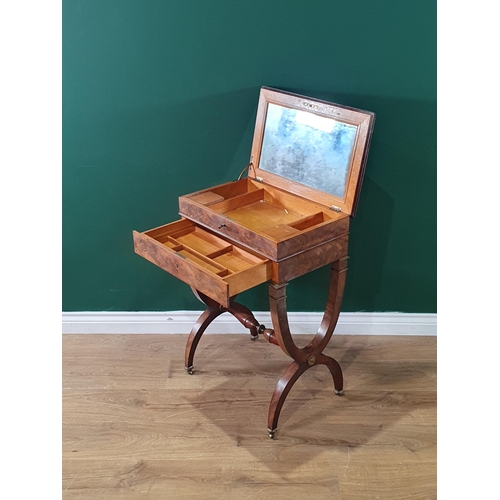 551 - A 19th century mahogany Dressing Table with hinged cover opening to reveal a mirror and compartments... 