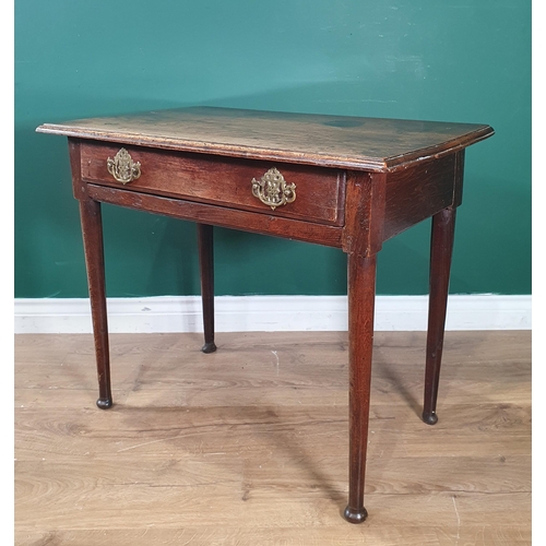 552 - An antique oak Side Table with moulded top, fitted frieze drawer, on turned tapering supports, 2ft 7... 