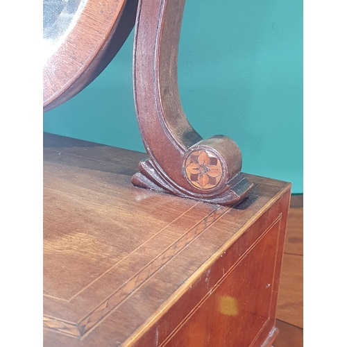 554 - A 19th century mahogany Toilet Mirror with shield-shaped bevelled plate, the inlaid base fitted thre... 