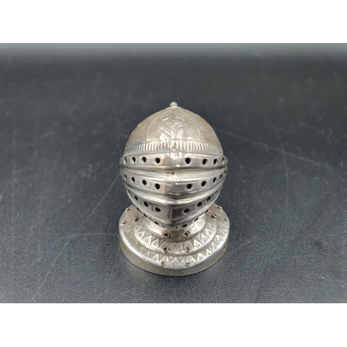 56 - A Victorian silver Pepperette in the form of a closed helmet on circular base, Birmingham 1898, make... 