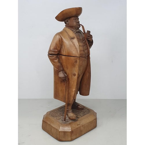 564 - A Treen Tobacco Jar in the form of a Gentleman smoking a Pipe, with Walking Stick, wearing Tricorn H... 