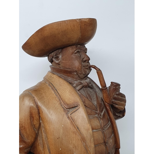 564 - A Treen Tobacco Jar in the form of a Gentleman smoking a Pipe, with Walking Stick, wearing Tricorn H... 