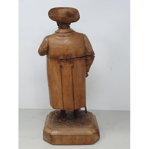 564 - A Treen Tobacco Jar in the form of a Gentleman smoking a Pipe, with Walking Stick, wearing Tricorn H... 