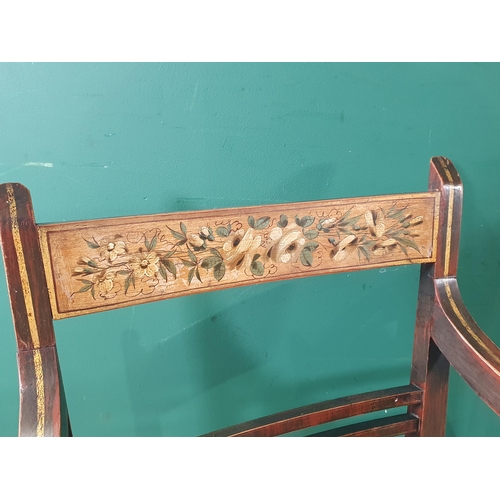 565 - A pair of 19th Century ash Elbow Chairs with floral painted bar-backs and rush seats raised on turne... 