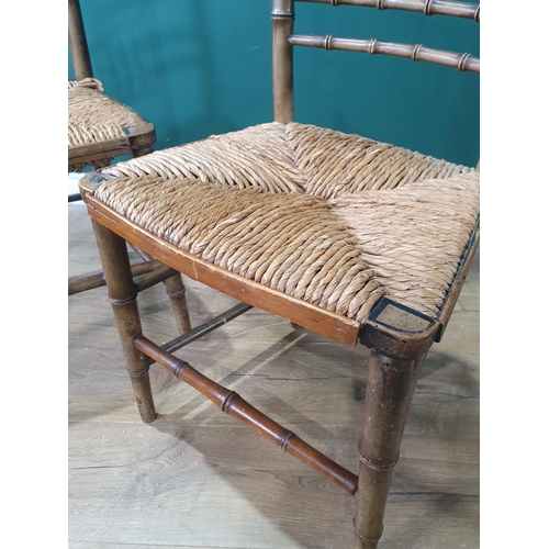 569 - A pair of 19th Century green painted bamboo effect Single Chairs with straw seats 2ft 10in H x 1ft 5... 