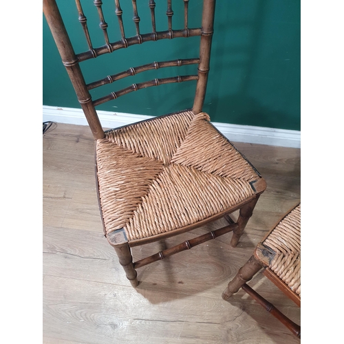 569 - A pair of 19th Century green painted bamboo effect Single Chairs with straw seats 2ft 10in H x 1ft 5... 