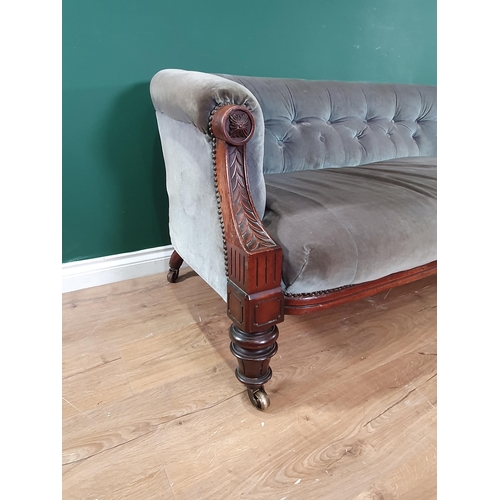 576 - A 19th Century carved walnut Salon Chesterfield, the button down back and stuff over seat on taper t... 