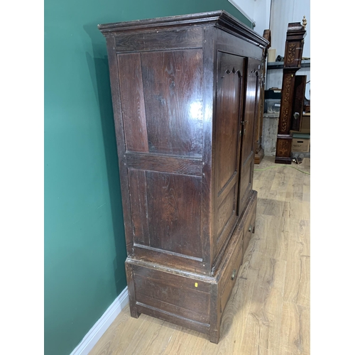 580 - An 18th Century oak Bacon Cupboard with pair of cupid's bow panelled doors above panelled doors, 5ft... 