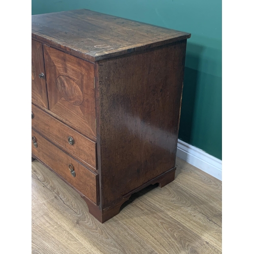 582 - A 19th Century mahogany Chest with oval panelled cupboard doors above two graduated drawers on brack... 