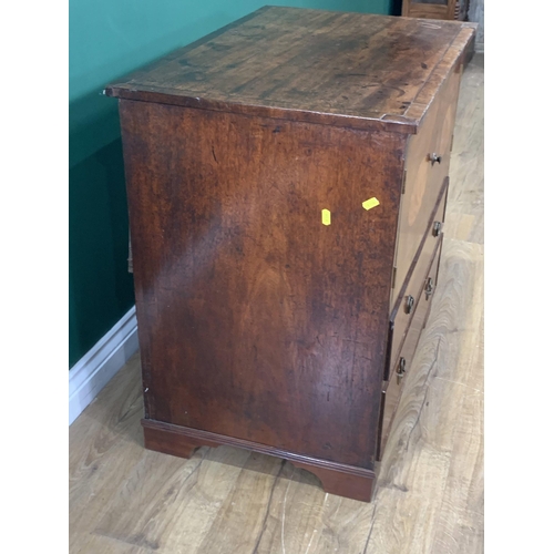 582 - A 19th Century mahogany Chest with oval panelled cupboard doors above two graduated drawers on brack... 