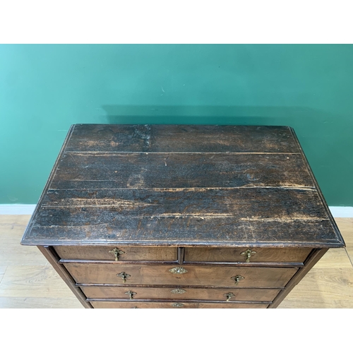 583 - An 18th Century walnut and oak Chest of two short and three long graduated drawers on bracket suppor... 