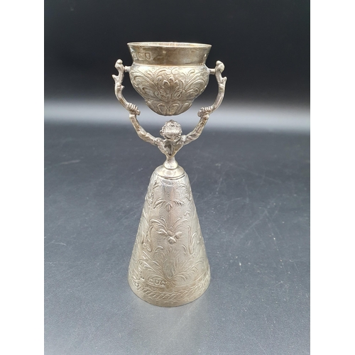 59 - A George V silver Wager Cup with floral and leafage scroll decoration,inscribed Grocers Hall 1910, L... 