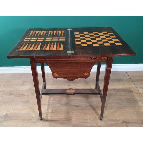 591 - A late Victorian rosewood fold-over Games/Sewing Table with floral inlay to the top, enclosing chequ... 