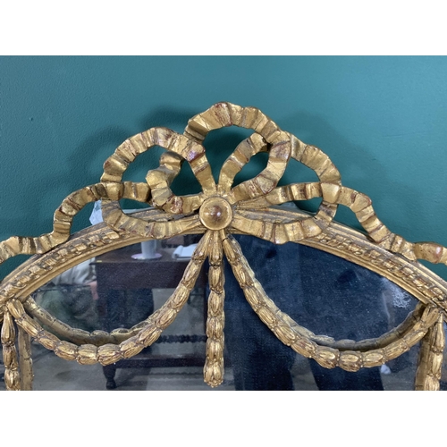 593 - A 19th Century gilded Wall Mirror with pierced ribbon surmount, and swag detail, the side mirrors di... 