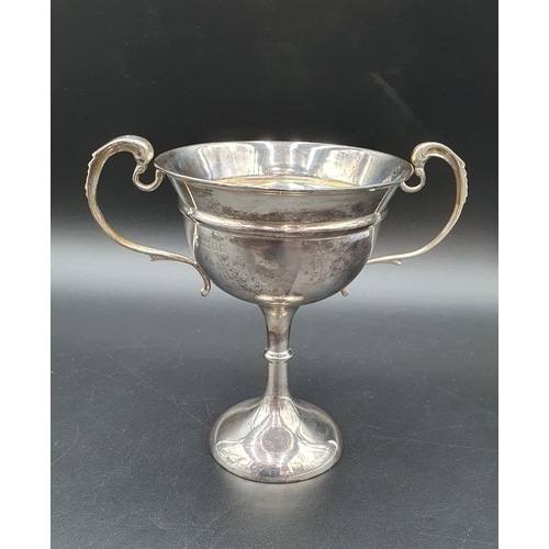 6 - A George V silver two handled Trophy with presentation inscription on single knop stem, London 1928,... 