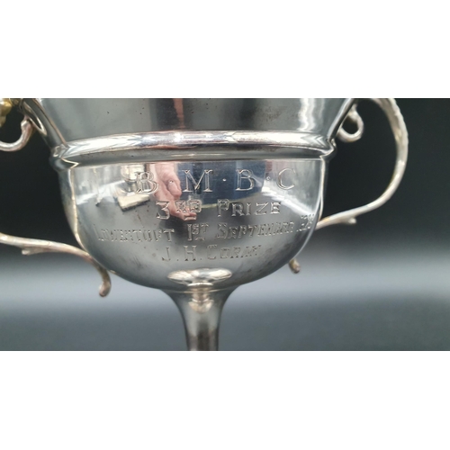 6 - A George V silver two handled Trophy with presentation inscription on single knop stem, London 1928,... 