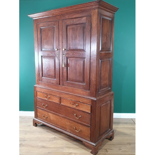 601 - An 18th Century oak Housekeeper's Cupboard fitted pair of fielded panel doors above base fitted two ... 