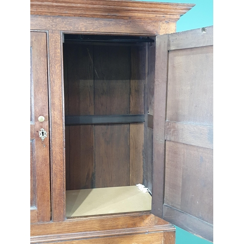 601 - An 18th Century oak Housekeeper's Cupboard fitted pair of fielded panel doors above base fitted two ... 