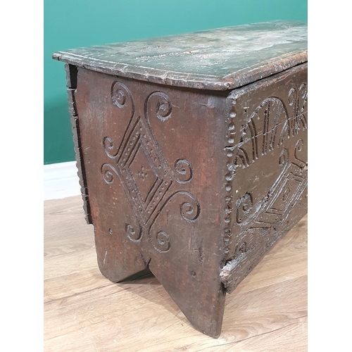 607 - A late 17th Century West Country oak six plank Chest with arcaded shallow carved frieze above a pair... 