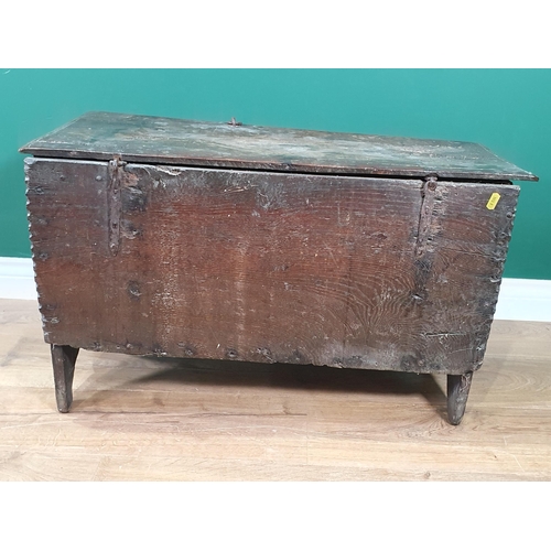 607 - A late 17th Century West Country oak six plank Chest with arcaded shallow carved frieze above a pair... 