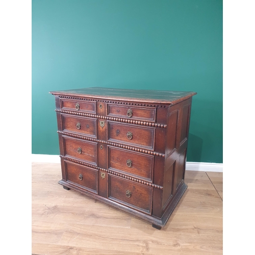 618 - A 17th Century oak Chest of four long drawers with moulded and beaded design on squared supports, 3f... 