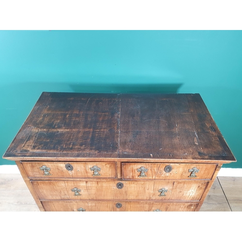 619 - An 18th Century walnut Chest of two short and three long graduated drawers on later bracket supports... 