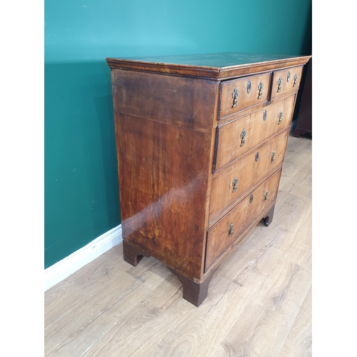 619 - An 18th Century walnut Chest of two short and three long graduated drawers on later bracket supports... 