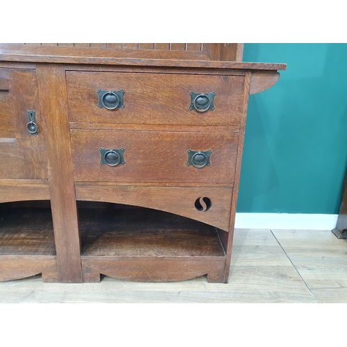 628 - An Arts and Crafts oak Dresser, the upper section fitted a pair of glazed door, the lower section fi... 