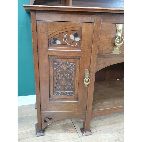 629 - An oak Art Nouveau Mirrorback Sideboard, the upper section with a pair of inlaid doors, the base fit... 