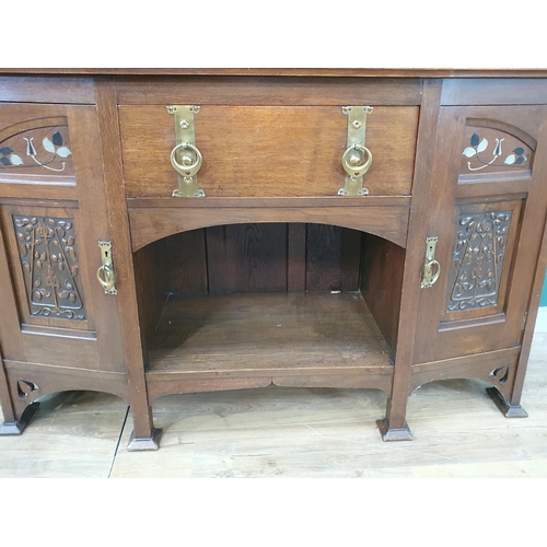 629 - An oak Art Nouveau Mirrorback Sideboard, the upper section with a pair of inlaid doors, the base fit... 