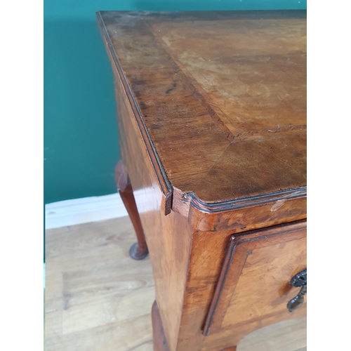 630 - A 19th Century walnut Lowboy with quarter veneered and crossbanded top, fitted three drawers around ... 