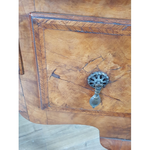 630 - A 19th Century walnut Lowboy with quarter veneered and crossbanded top, fitted three drawers around ... 