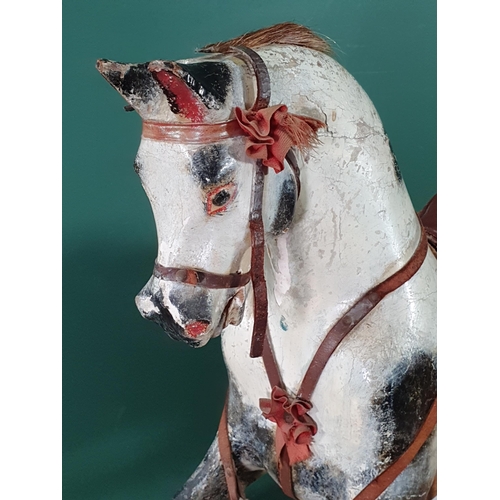 643 - A painted and carved wooden Rocking Horse by Lines Bros for Triang with mane (lacks tail), saddle an... 