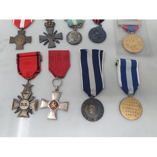 659 - Nine European Military Medals including Cross of Merit of the order of the Lion (Norway), Greek 1940... 