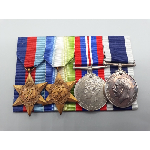 662 - Four; WWII 1939-45 Star, Atlantic Star, War Medal and Royal Navy Long Service and Good Conduct Medal... 