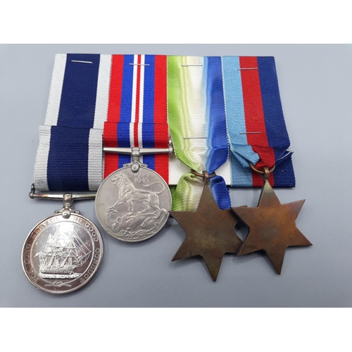 662 - Four; WWII 1939-45 Star, Atlantic Star, War Medal and Royal Navy Long Service and Good Conduct Medal... 