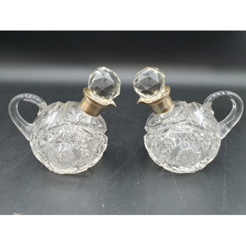 72 - A pair of George V silver mounted small cut glass Flasks in the form of birds, Birmingham 1913