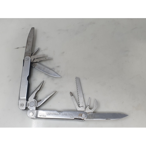 744 - A Swiss Army 'Camping' multi-tool Penknife and a Leatherman 'Supertool' multitool Pocketknife