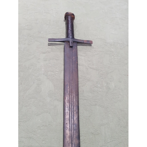 746 - An antique Sudanese Kaskara with leather wrapped grip and metal 'T' guard 3ft 5in L overall