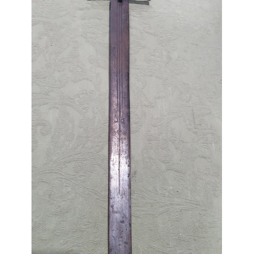 746 - An antique Sudanese Kaskara with leather wrapped grip and metal 'T' guard 3ft 5in L overall