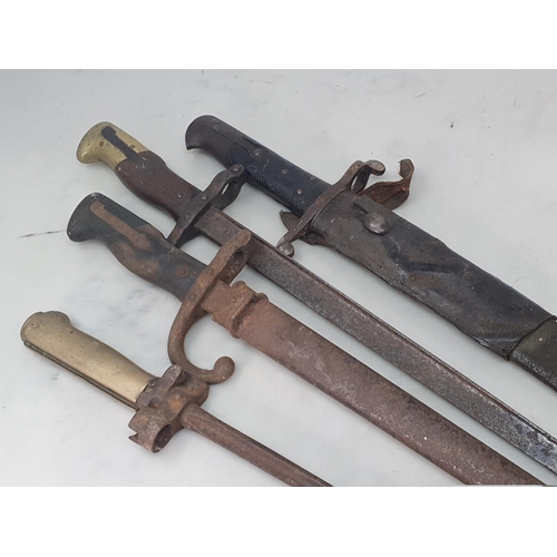 748 - Two Gras Bayonets, one with scabbard, another Bayonet in leather Scabbard, a Spike Bayonet, an Ameri... 