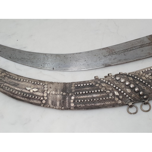 750 - A Saudi Arabian Wahabite Dagger of large proportions with finely worked eastern silver decoration, 2... 