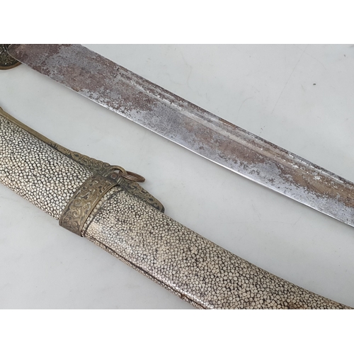 758 - A 19th Century Chinese Short Sword with brass mounted shagreen scabbard, leafage engraved brass guar... 