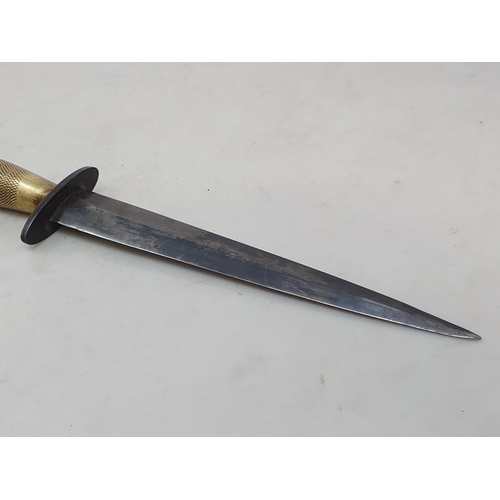 762 - A Fairbairn-Sykes 2nd Pattern Fighting Knife with brass grip in brass mounted leather sheath 11 3/4i... 