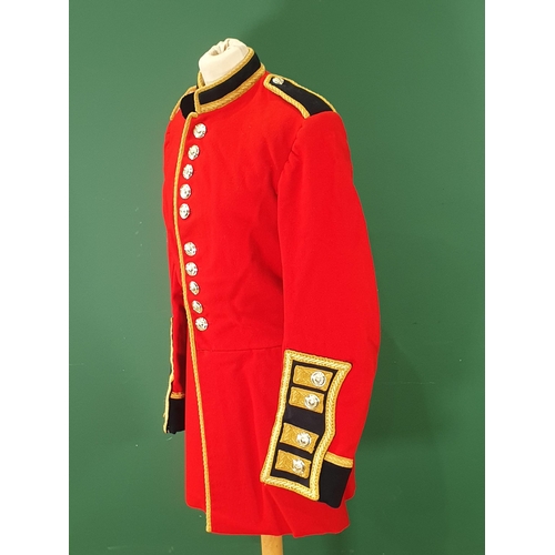 764 - A Welsh Guards scarlet Tunic with stay bright buttons