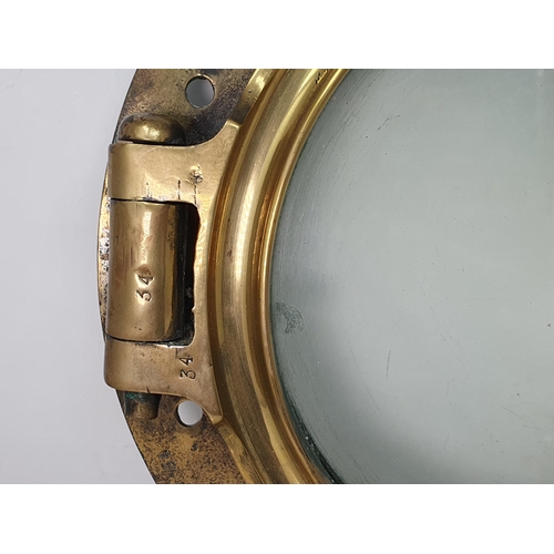 767 - An antique brass Ship's Porthole, 16in D