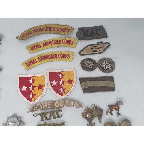 779 - A quantity of mainly British Army Buttons, Shoulder Badges and other Badges including 'The King's Ow... 