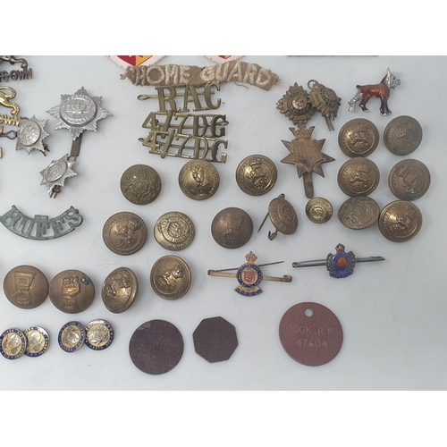 779 - A quantity of mainly British Army Buttons, Shoulder Badges and other Badges including 'The King's Ow... 