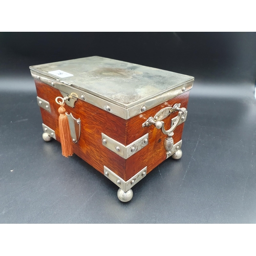 78 - A Victorian plated mounted oak Tea Caddy with scroll engraved lid enclosing two lidded divisions, or... 